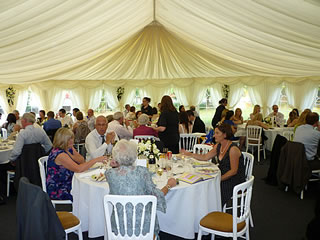 A wedding in a marquee at Lowsonford Village Hall